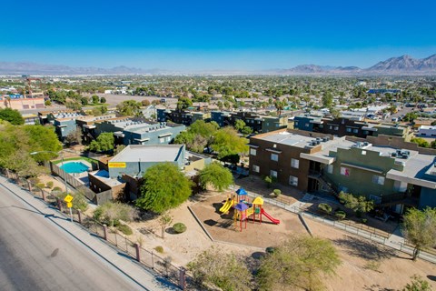 an aerial view of a neighborhood with a playground and houses at Maryland Villas Apartments, Nevada, 89101